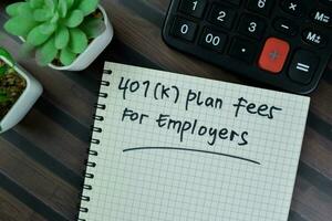 Concept of 401 K Plan Fees For Employers write on a book isolated on Wooden Table. photo