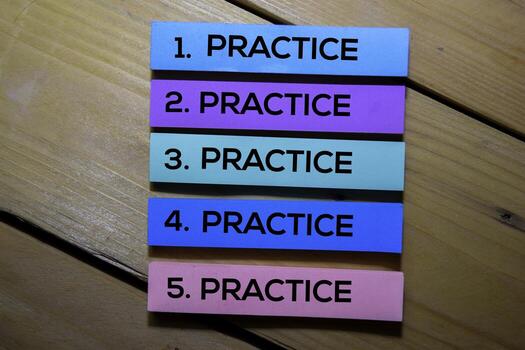Practice. Practice. Practice. Practice. Practice text on sticky notes isolated on the tables photo