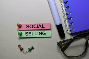 Social Selling text on sticky notes isolated on office desk photo