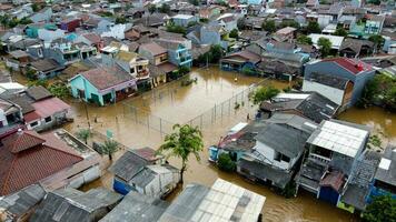 Aerial POV view Depiction of flooding. devastation wrought after massive natural disasters at Bekasi - Indonesia photo