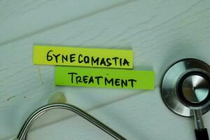 Gynecomastia Treatment text on Sticky Notes. Top view isolated on office desk. Healthcare Medical concept photo
