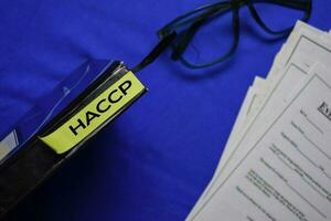 HACCP text on sticky notes isolated on office desk. photo