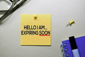 Hello I am Expiring Soon text on sticky notes isolated on office desk photo