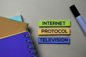 Internet Protocol Television - IPTV text on sticky notes isolated on office desk photo