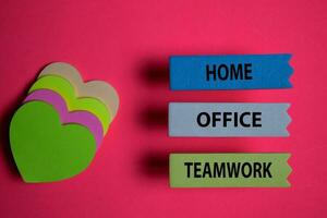 Home Office Teamwork write on a sticky note isolated on Office Desk. photo