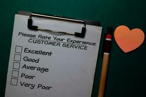 Customer Service write on a paperwork isolated on Office Desk photo