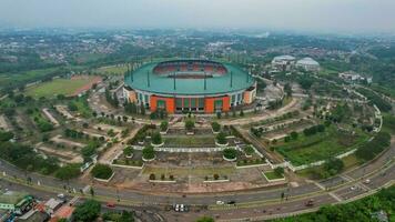 Aerial view of the Beautiful scenery of Pakansari Stadium. with Bogor cityscape background. Bogor, Indonesia, August 23, 2022 photo