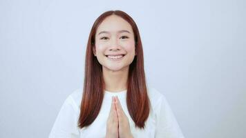 asian girl laughing and smiling expressing gratitude, namaste gesture, thank you. video