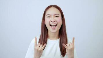 Asian woman showing rocker sign feeling enthusiastic video