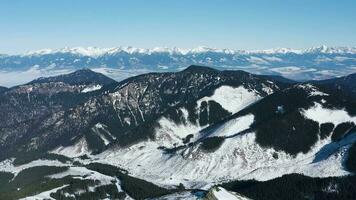 Aerial view of the snowy High Tatras Mountains in clear weather. Slovakia, Chopok video