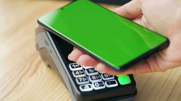 Mobile payment. Contactless payment with your smartphone with green mock-up screen. Wireless payment concept. video