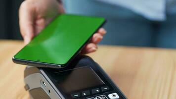 Mobile payment. Contactless payment with your smartphone with green mock-up screen. Wireless payment concept. video