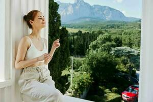 beautiful woman comfortable hotel luxurious green nature view Summer day photo