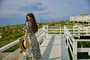 portrait of a woman in dress walk luxury tourism summer Relaxation concept photo