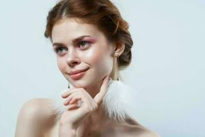 Cheerful Woman Bare Shoulders Fluffy Earrings Cosmetics Jewelry photo