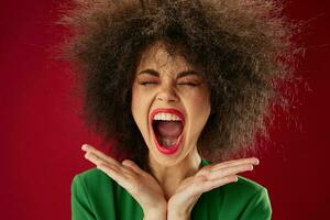 Pretty young female grimace afro hairstyle red lips fashion color background unaltered photo