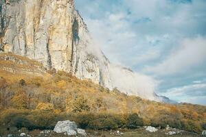 landscape autumn high mountains on blue sky dry grass fresh air photo