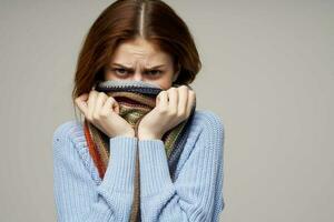 red-haired woman neck scarf cold handkerchief close-up photo