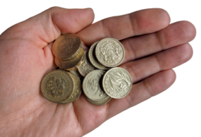 one pound coins in hand transparent PNG