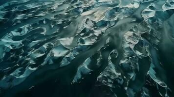 A chilly conduit from over. Ethereal photo of the stream streams from Icelandic chilly masses. video