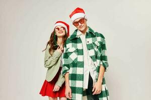 Man and woman wearing sunglasses New Years holiday together fun hugs photo
