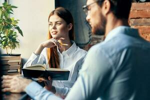 business man and woman chatting in a cafe work lifestyle photo