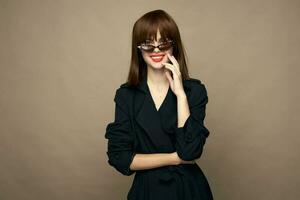 Elegant woman classic coat bright makeup rejoicing indoors photo