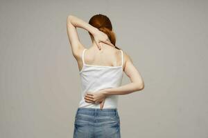 woman back pain health problems osteoporosis isolated background photo