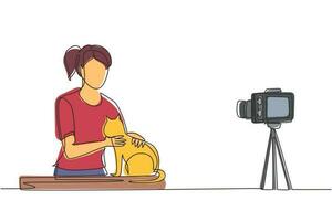 Continuous one line drawing vet blogger sitting in front of camera with cats and recording video blog about animals, pets. Zoo psychologist creating content for vlog. Single line draw design vector