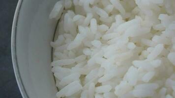 cooked fried rice in a bowl on table, close up video