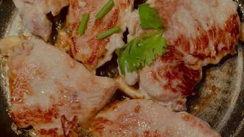 Slices of pork grilled on a hot stove. Pork steak. video