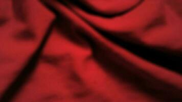 Abstract background with crumpled cloth. Dark red realistic silk texture with empty space. Vector illustration