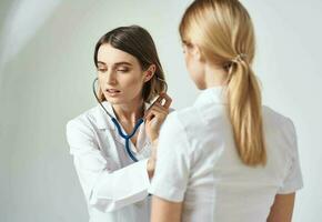 professional doctor with stethoscope heartbeat patient health work photo