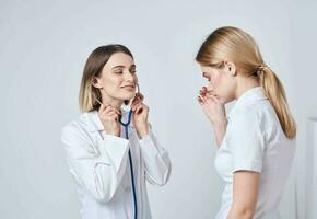 The patient complains to the doctor at will and a blue stethoscope photo