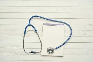 stethoscope with notepad hospital health care photo