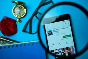 Wifi Map Free Passwords  Hotspots dev app with magnifying on Smartphone screen. Wifi is a freeware web browser developed by Wifi Map LLC photo