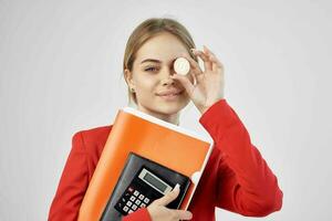 financier in a red jacket with documents in hand light background photo