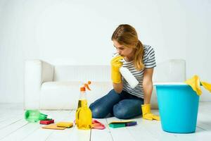 Woman cleaning room cleaning hygiene and interior detergent service photo