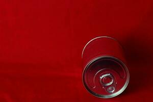 close up milk cans rolling in red background photo