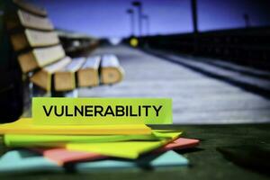 Vulnerability on the sticky notes with bokeh background photo