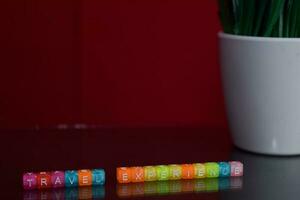 Travel experience text at colorful wooden block on red background. Desk office and education concept photo