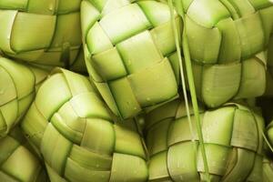 Ketupat asian rice dumpling. Ketupat is a natural rice casing made from young coconut leaves for cooking rice during eid Mubarak Eid ul Fitr photo