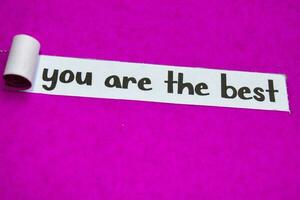 Your Are the Best text, Inspiration, Motivation and business concept on purple torn paper photo