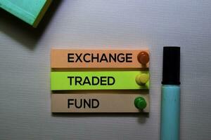 Exchange Traded Fund  text on sticky notes isolated on office desk photo