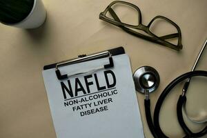 NAFLD - Non-Alcoholic Fatty Liver Disease write on a paperwork isolated on office desk. photo