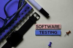 Software Testing text on sticky notes isolated on office desk photo