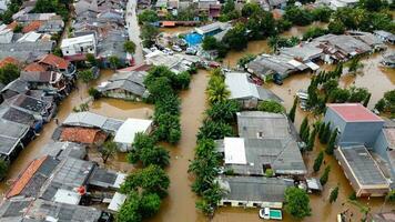 Aerial POV view Depiction of flooding. devastation wrought after massive natural disasters at Bekasi - Indonesia photo