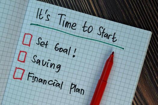 It's Time to Start write on a book isolated on Wooden Table. Suported by additional service. photo