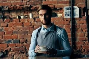 male waiter wearing apron coffee cup service lifestyle photo