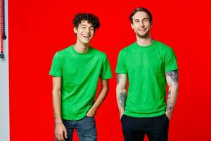 two men in green t-shirts three squads emotions fun photo